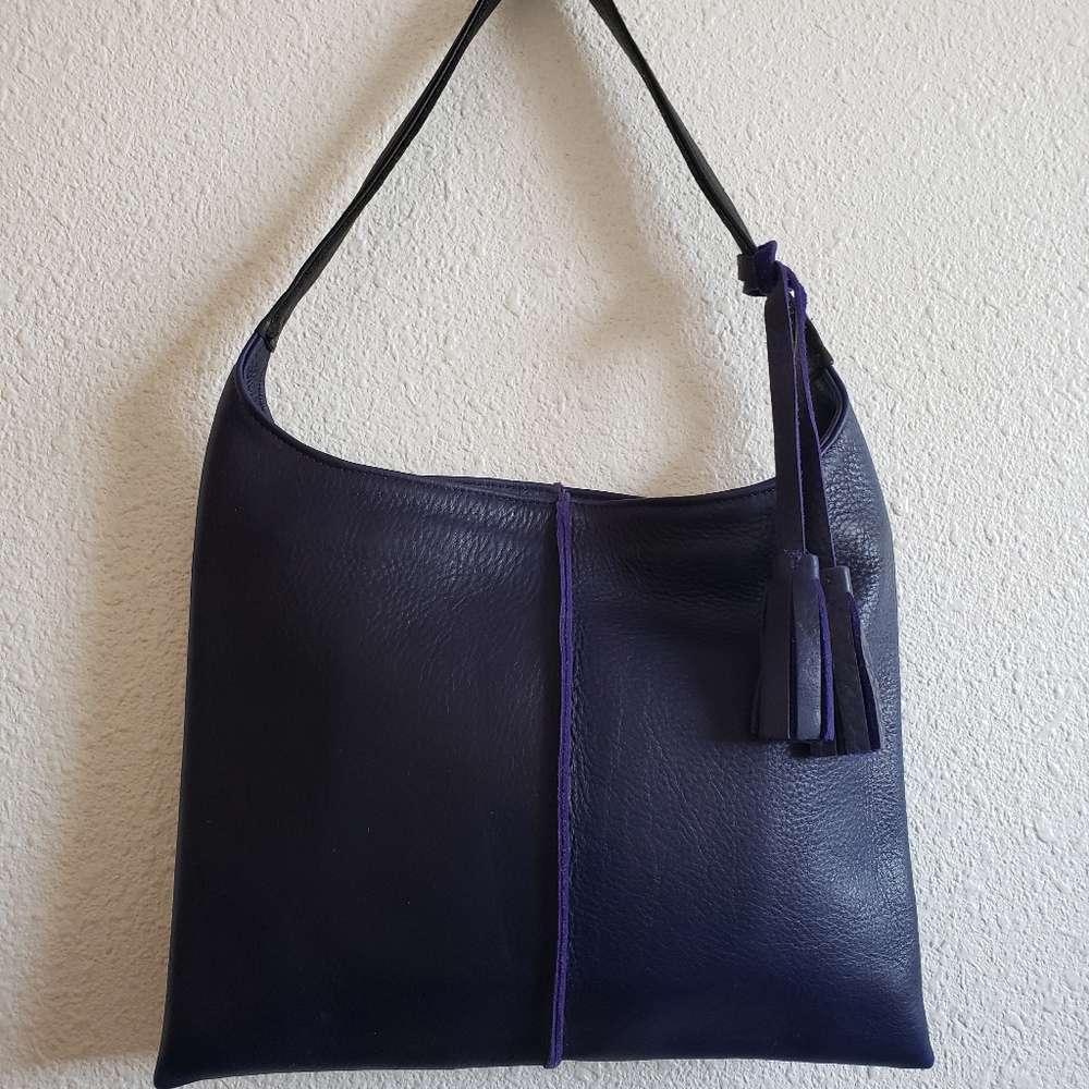 Dark purple artisan leather Cartera bag.